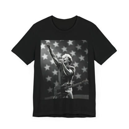 A black graphic t-shirt featuring a 70s era Americana-style graphic of Bruce Springsteen.