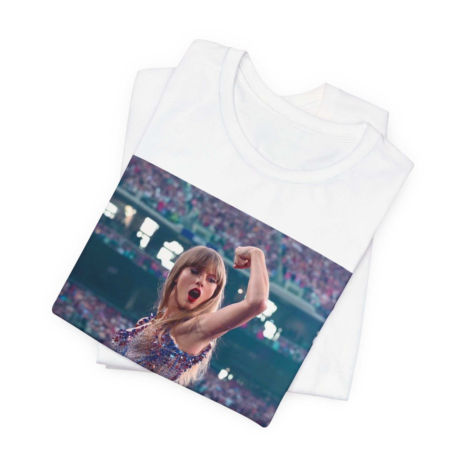 A black graphic t-shirt featuring a graphic or photo of Taylor Swift performing live on stage.