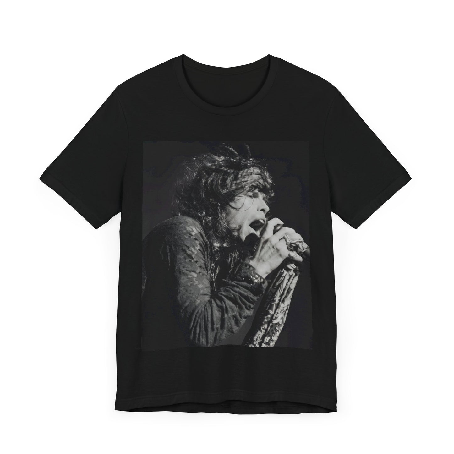 A black graphic t-shirt featuring a retro 70s-style illustration or photo of Aerosmith, designed to evoke their 'On Tour' presence, possibly with band members on stage or tour bus imagery.