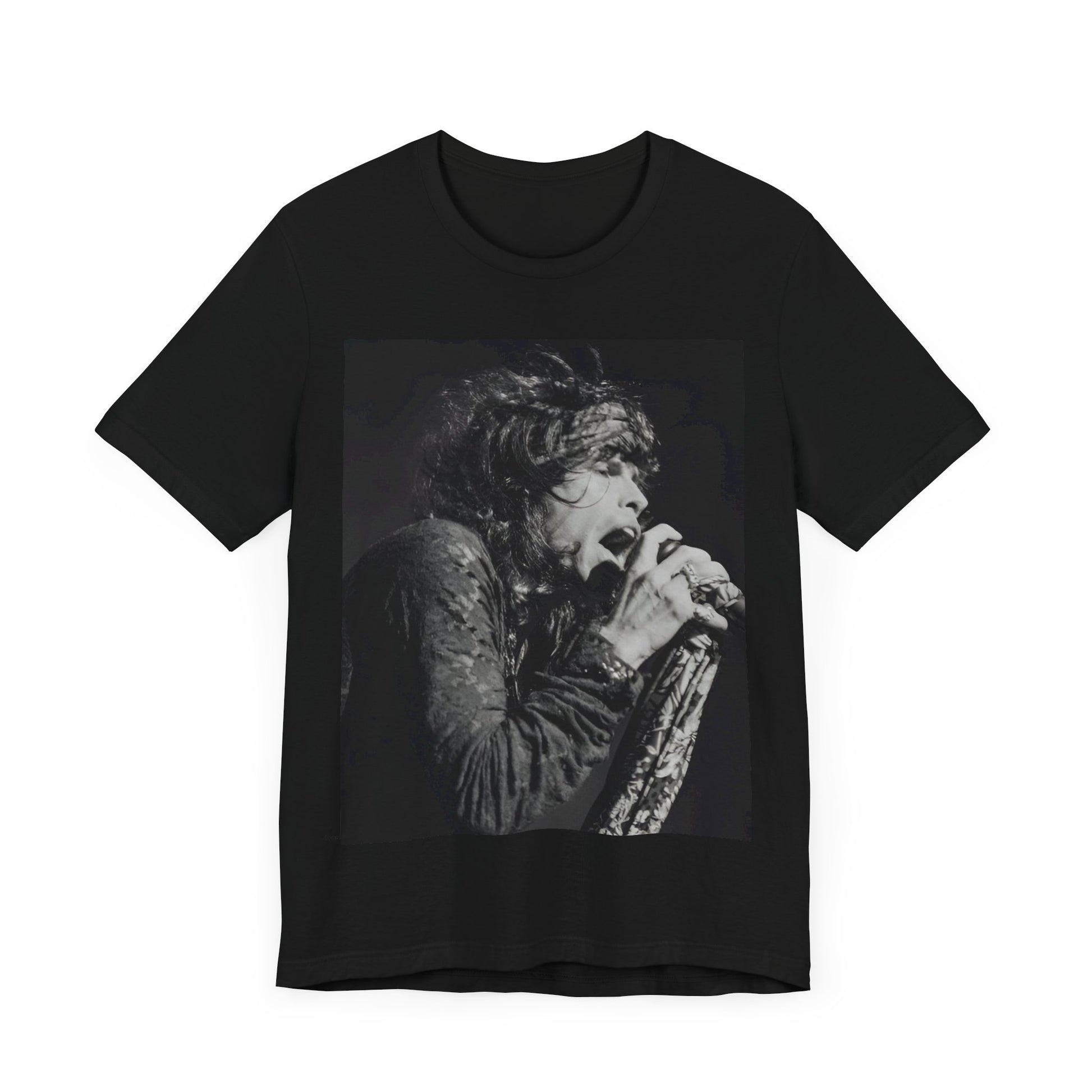 A black graphic t-shirt featuring a retro 70s-style illustration or photo of Aerosmith, designed to evoke their 'On Tour' presence, possibly with band members on stage or tour bus imagery.