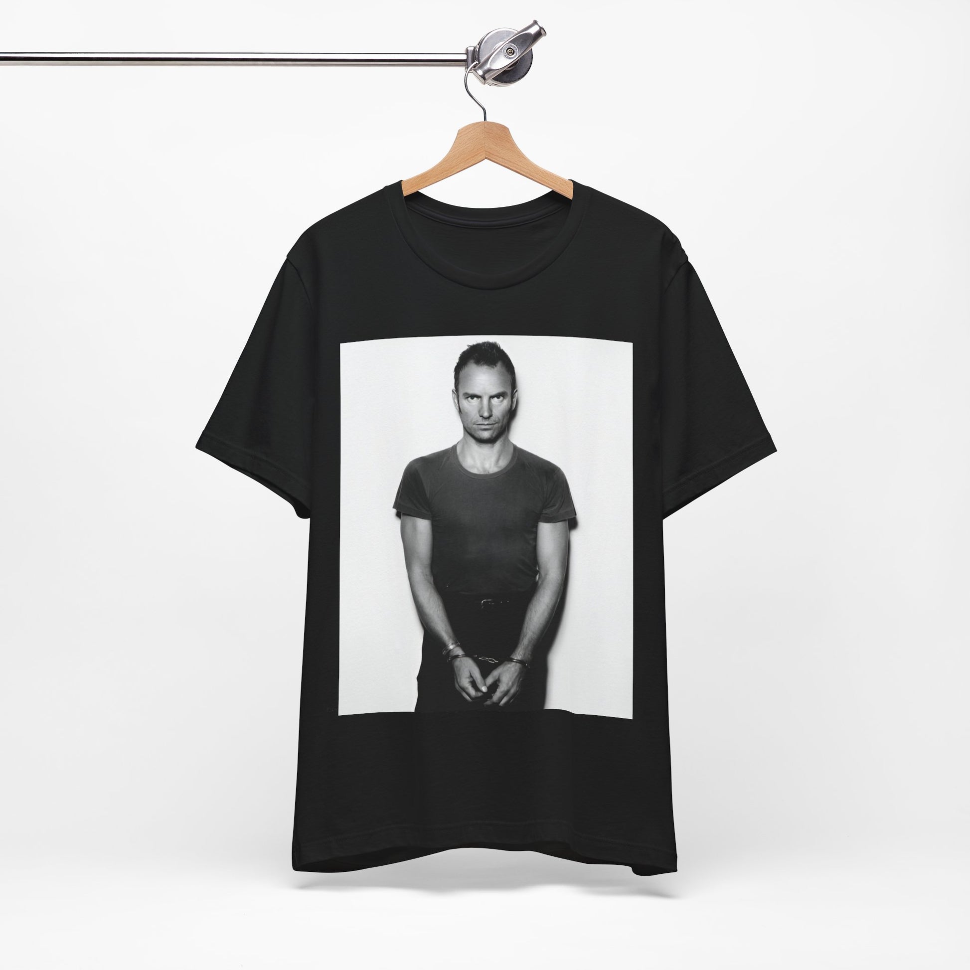 A black graphic t-shirt featuring a black and white portrait photo of Sting.