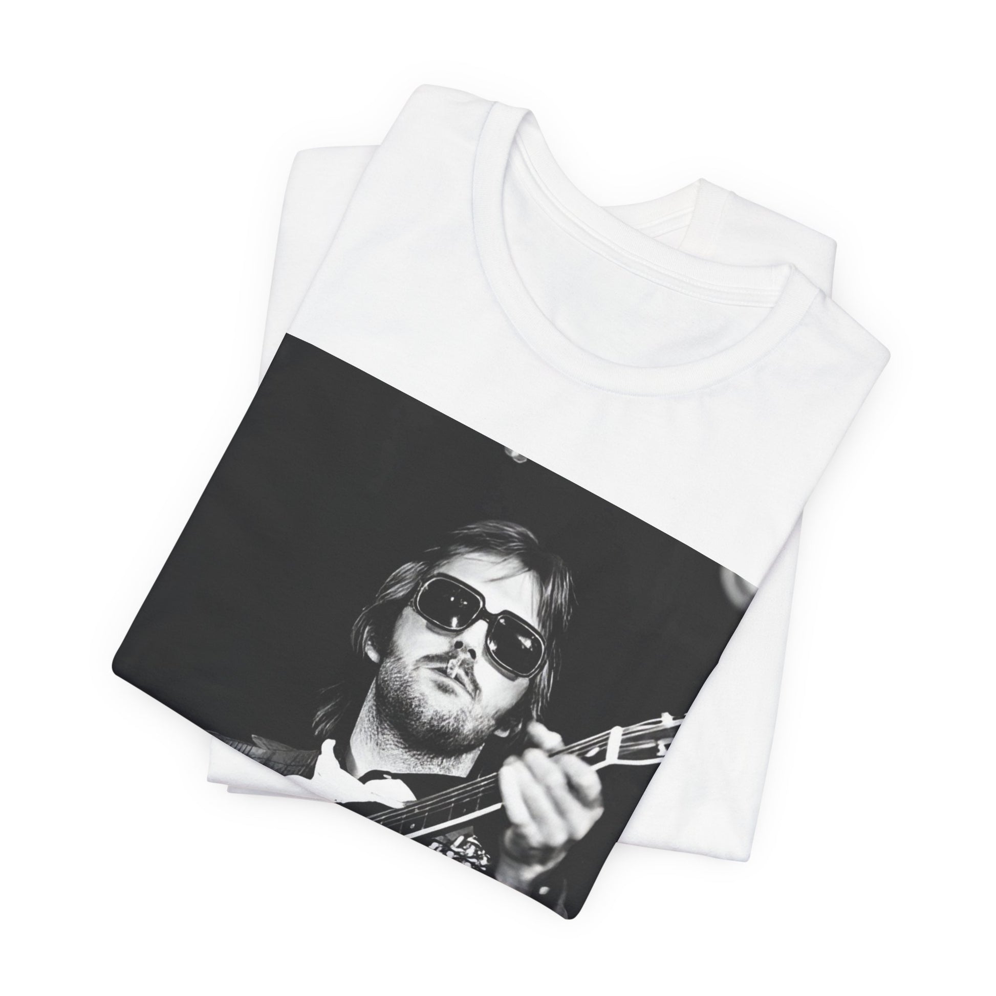 A black graphic t-shirt featuring a graphic of Eric Clapton with a chill blues rock vibe.