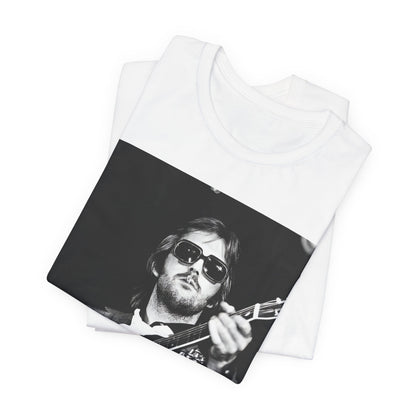 A black graphic t-shirt featuring a graphic of Eric Clapton with a chill blues rock vibe.
