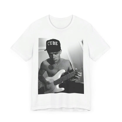 A black graphic t-shirt featuring a black and white graphic or photo of Flea from Red Hot Chili Peppers performing live on stage.