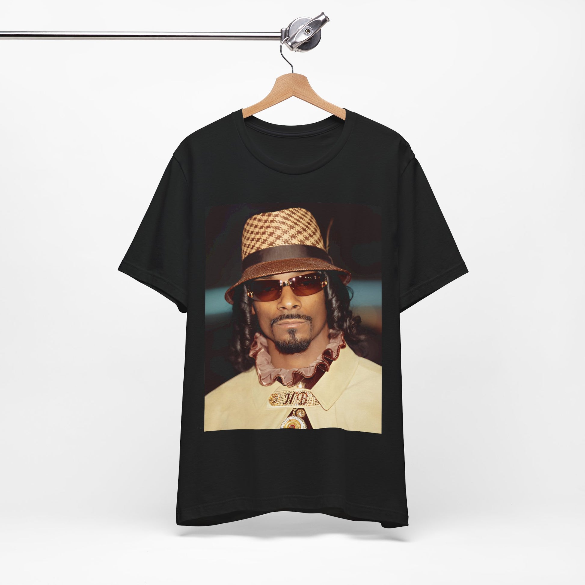 A black graphic t-shirt featuring a glamorous graphic of Snoop Dogg as a Doggfather icon.