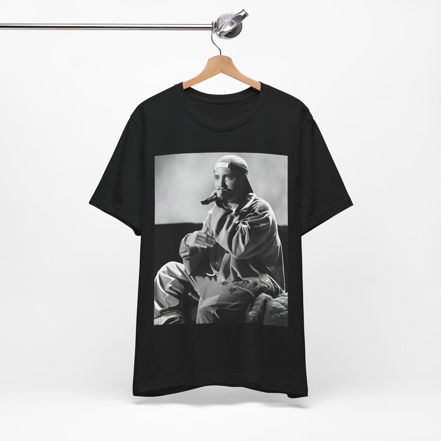 A black graphic t-shirt featuring a black and white graphic of Eminem as a 'Rap Messiah'.