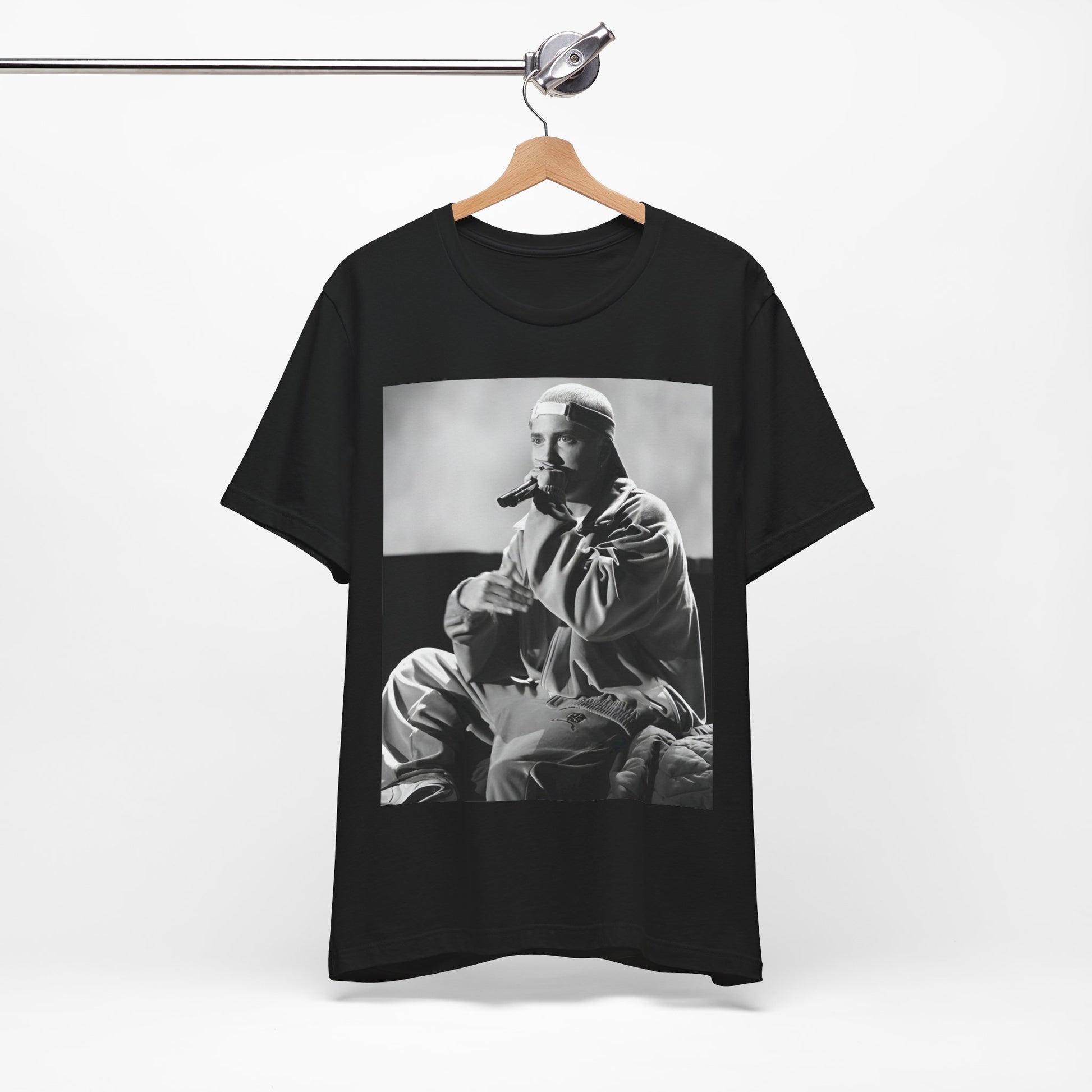 A black graphic t-shirt featuring a black and white graphic of Eminem as a 'Rap Messiah'.
