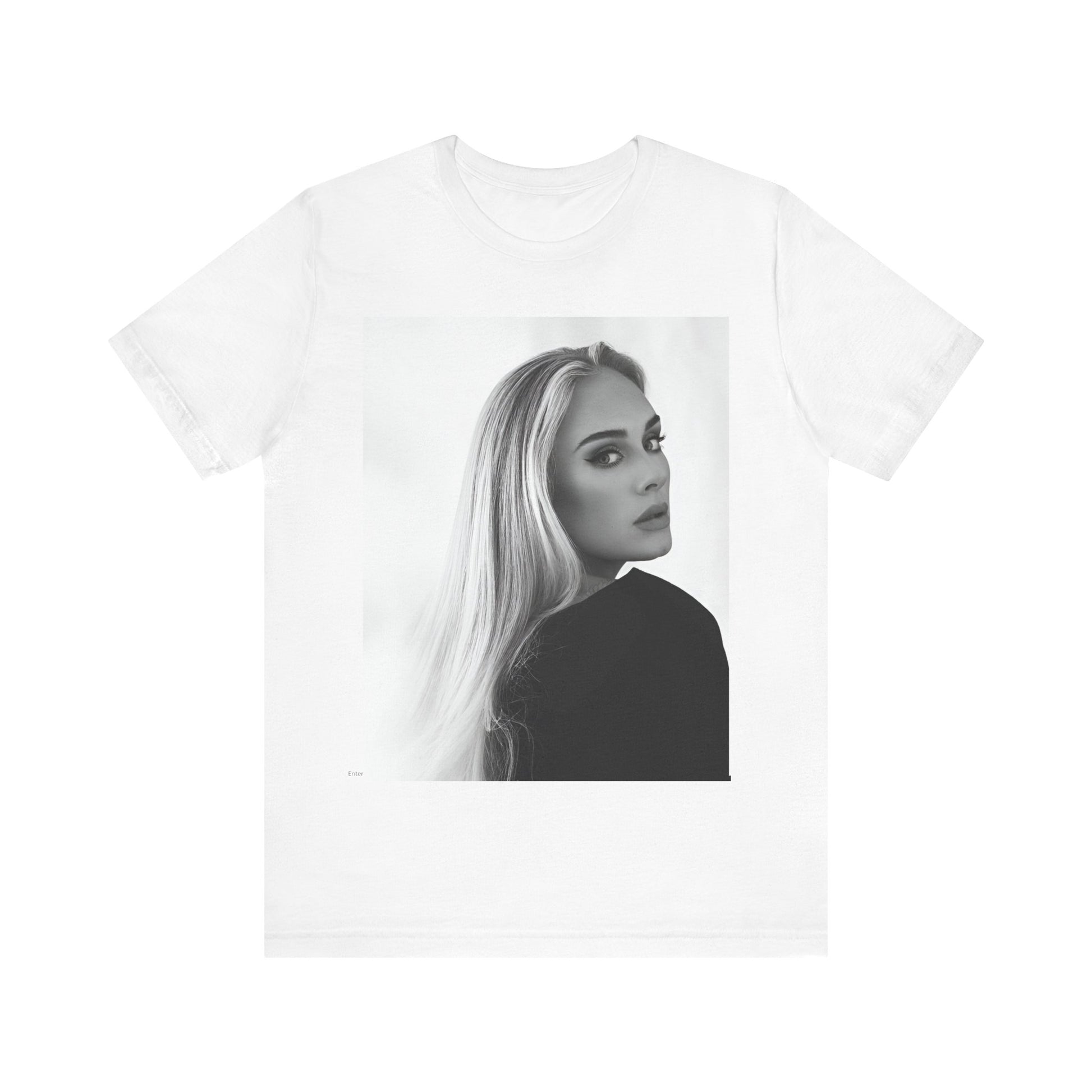 A black graphic t-shirt featuring a black and white, monochromatic portrait of Adele, showing her with a serene or thoughtful expression.