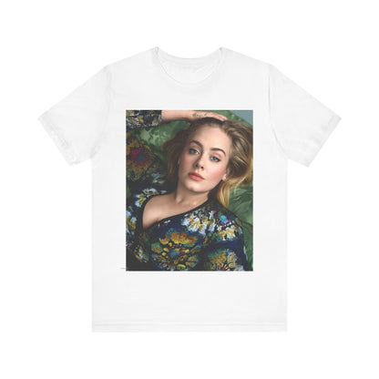 A black graphic t-shirt featuring a photo of Adele, possibly with floral elements or a floral background, showing a serene or contemplative expression.