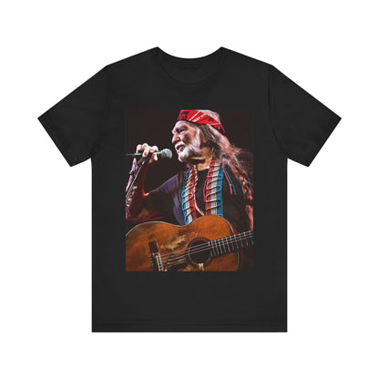 A black graphic t-shirt featuring a graphic of Willie Nelson with his iconic long hair and bandana.