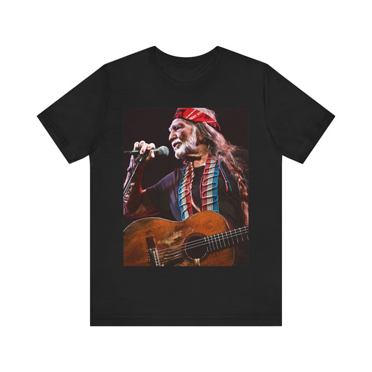 A black graphic t-shirt featuring a graphic of Willie Nelson with his iconic long hair and bandana.