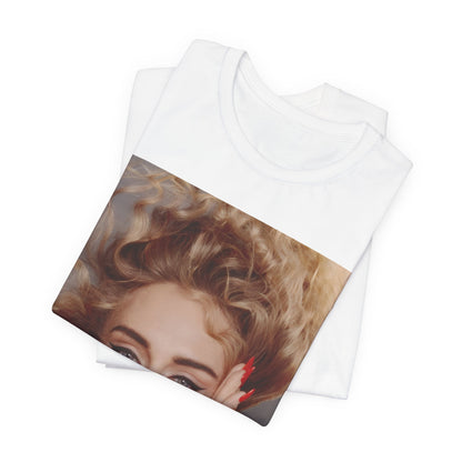A black graphic t-shirt featuring a detailed, artistic black and white portrait of Adele with her hair dramatically caught in a breeze around her face and her hands gently placed on her cheeks.