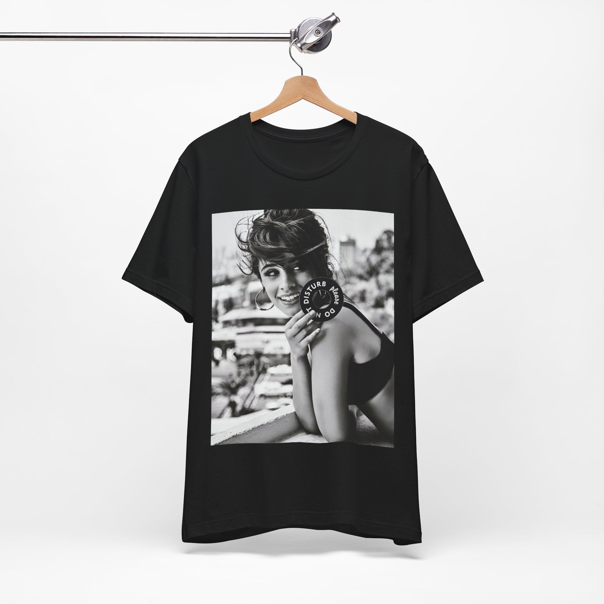 A black graphic t-shirt featuring a black and white photo or graphic of Camila Cabello in an iconic style.
