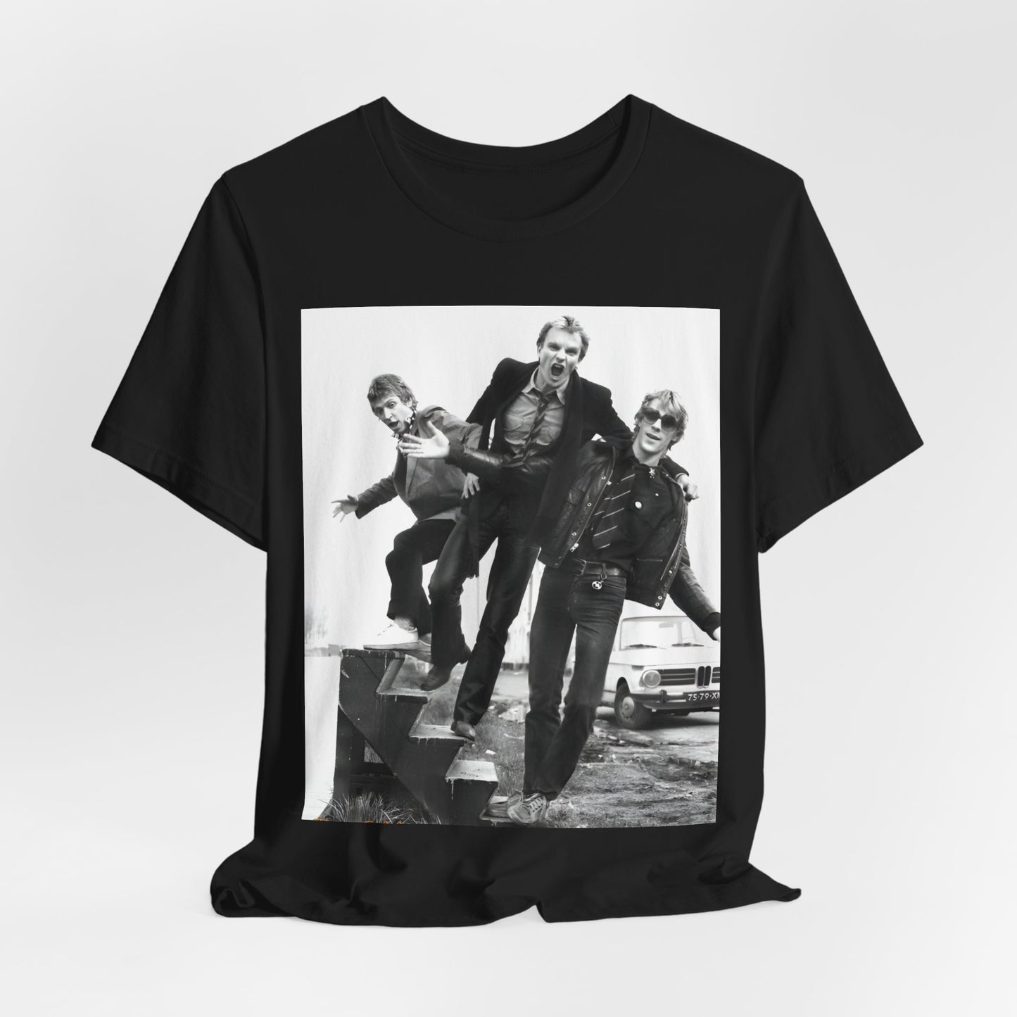 A black graphic t-shirt featuring an early days reggae rock graphic of The Police.