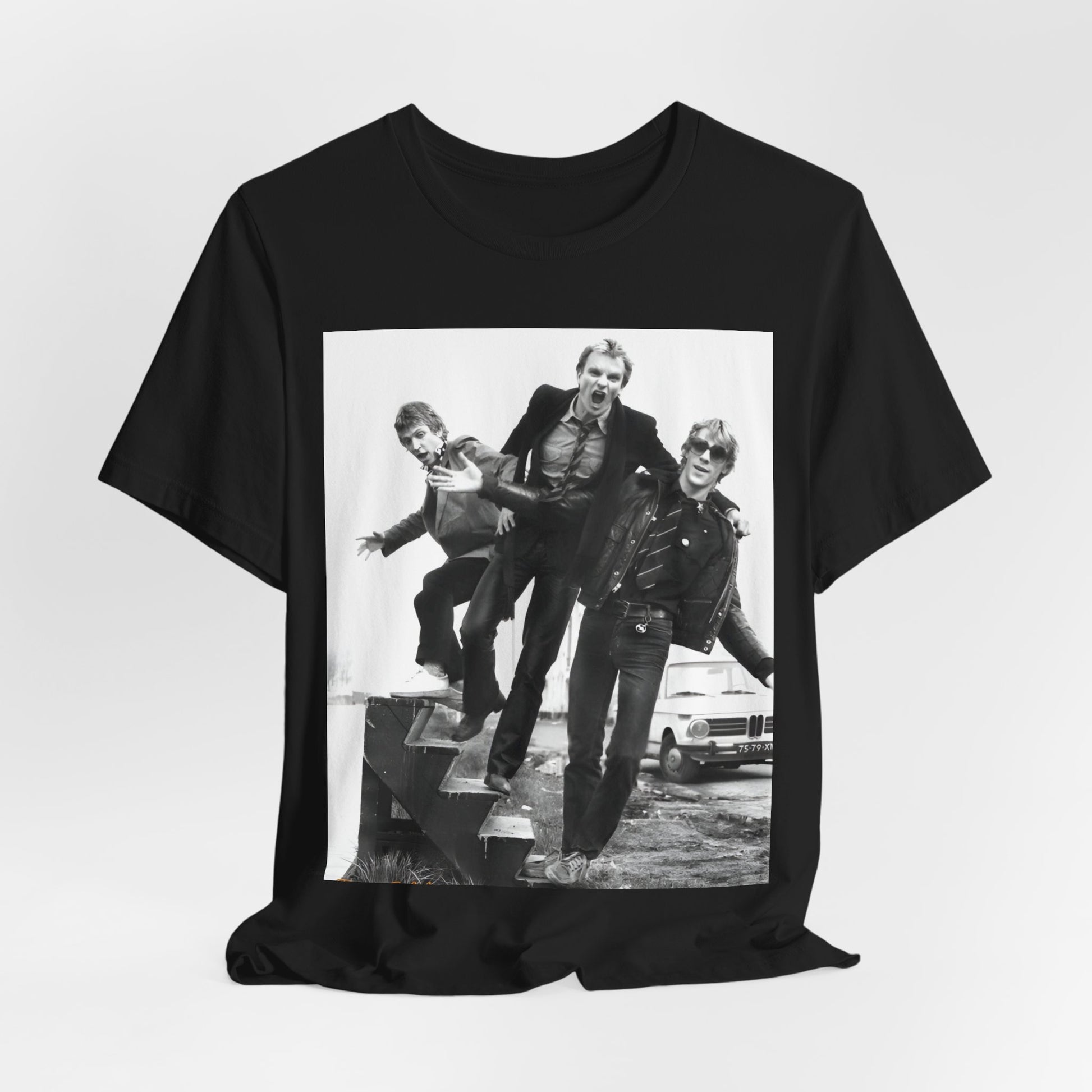 A black graphic t-shirt featuring an early days reggae rock graphic of The Police.