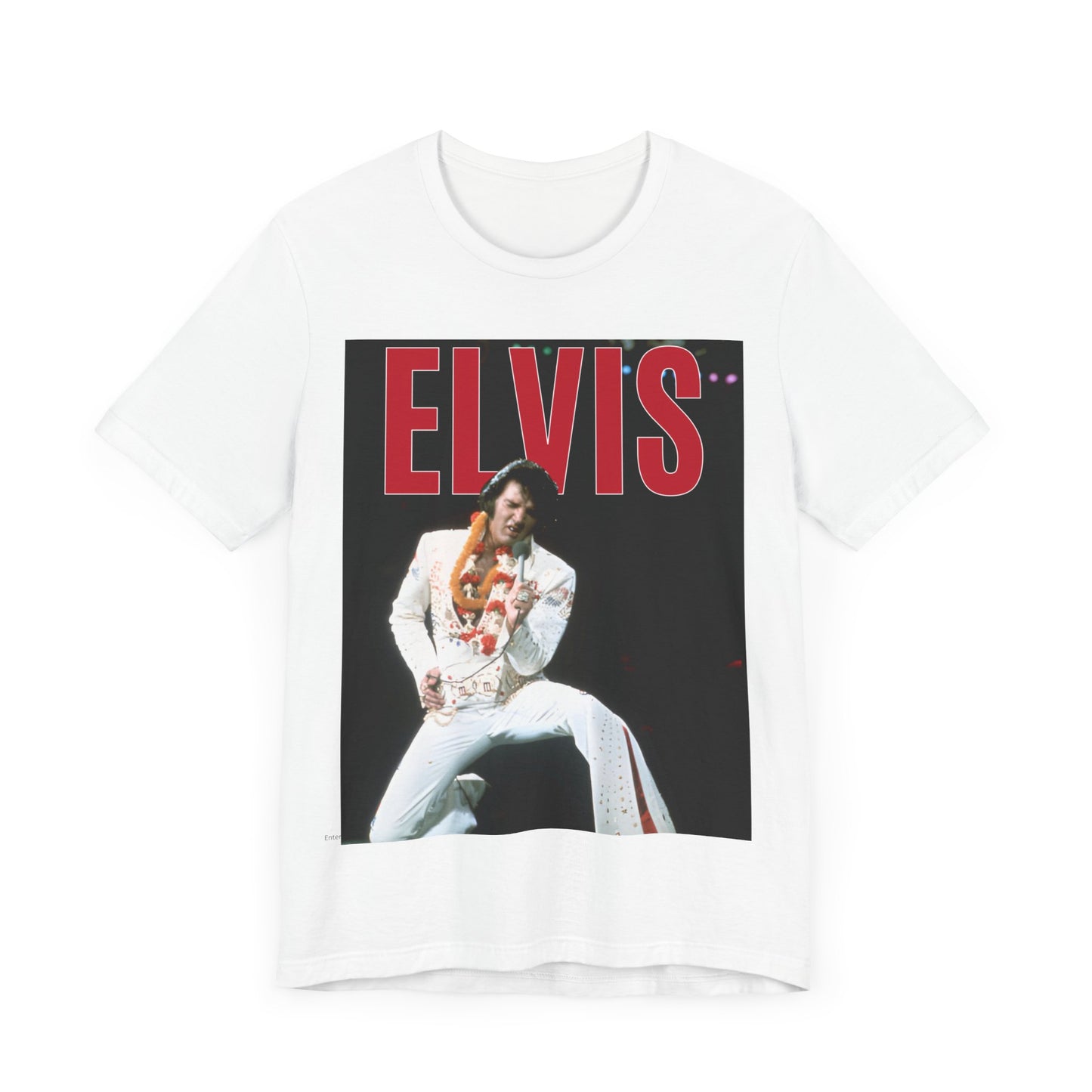 A black graphic t-shirt featuring a glamorous graphic or photo of Elvis Presley on a Las Vegas stage.