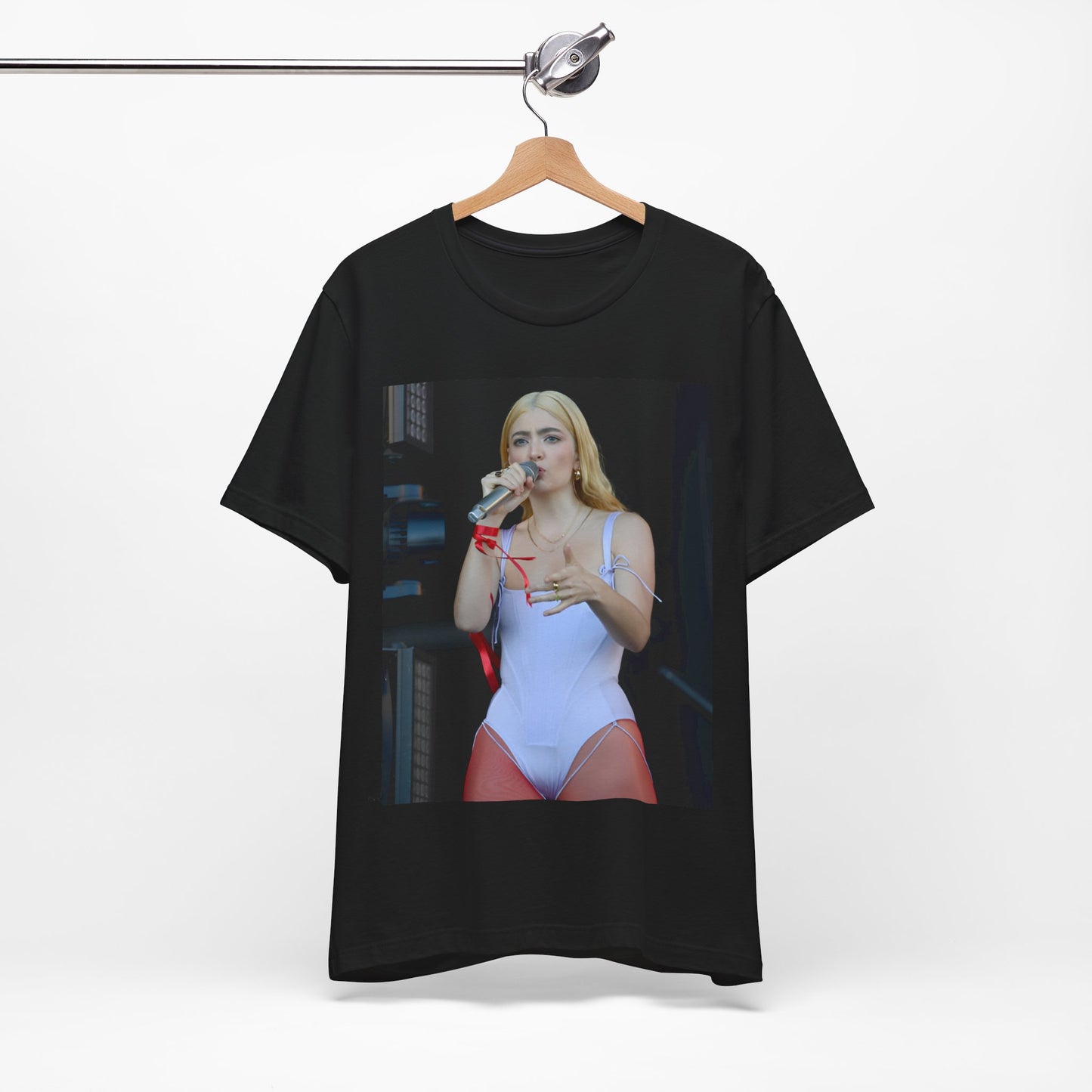 A black graphic t-shirt featuring a graphic or photo of Lorde performing on stage in a cool alternative music style.