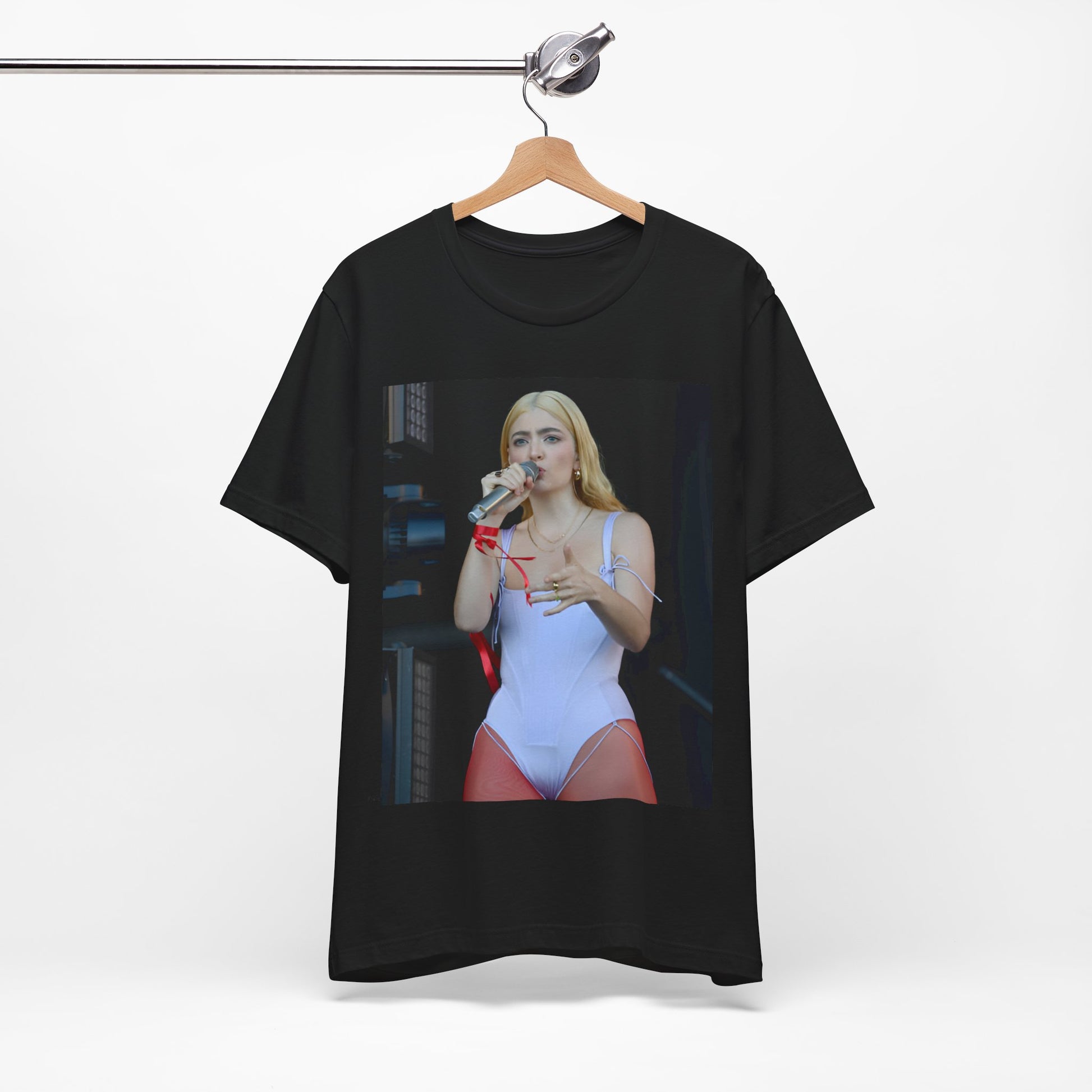 A black graphic t-shirt featuring a graphic or photo of Lorde performing on stage in a cool alternative music style.