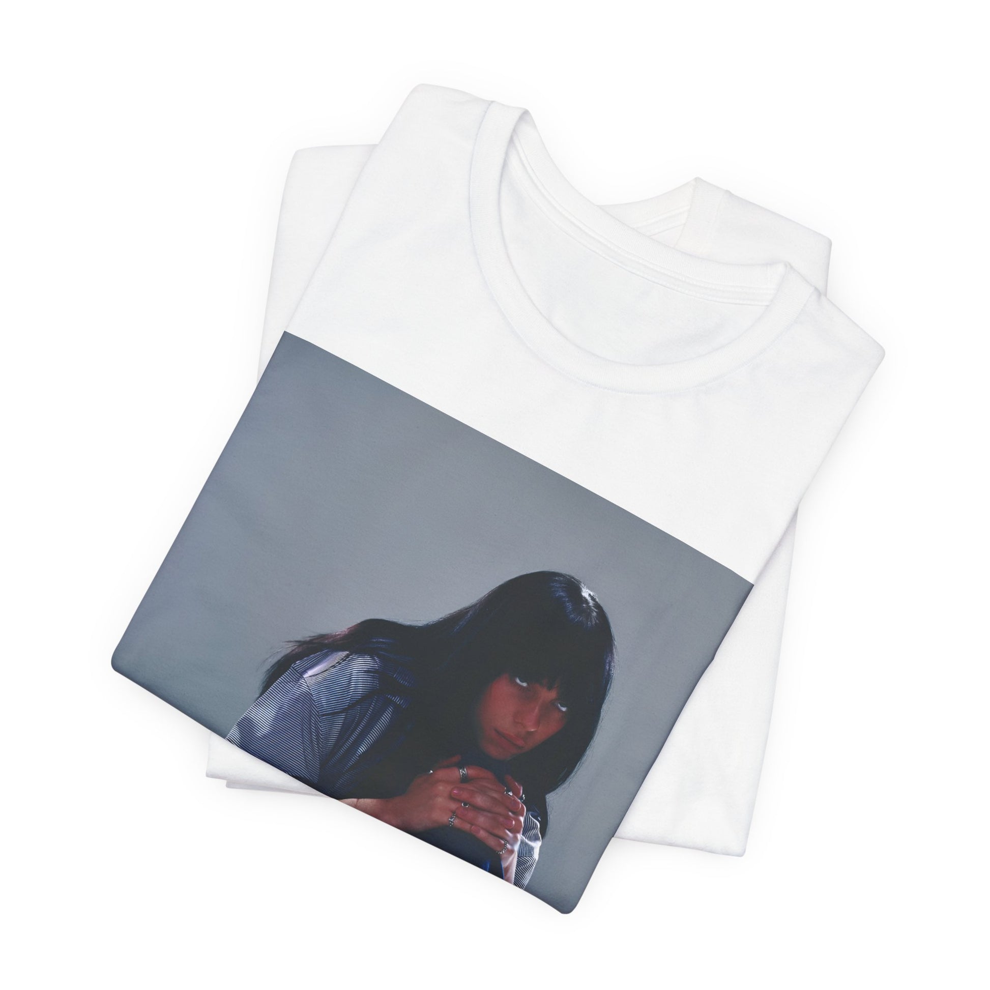 An artistic and slightly melancholic graphic t-shirt inspired by Billie Eilish's song "Lovely," featuring soft colors and a dreamy style.