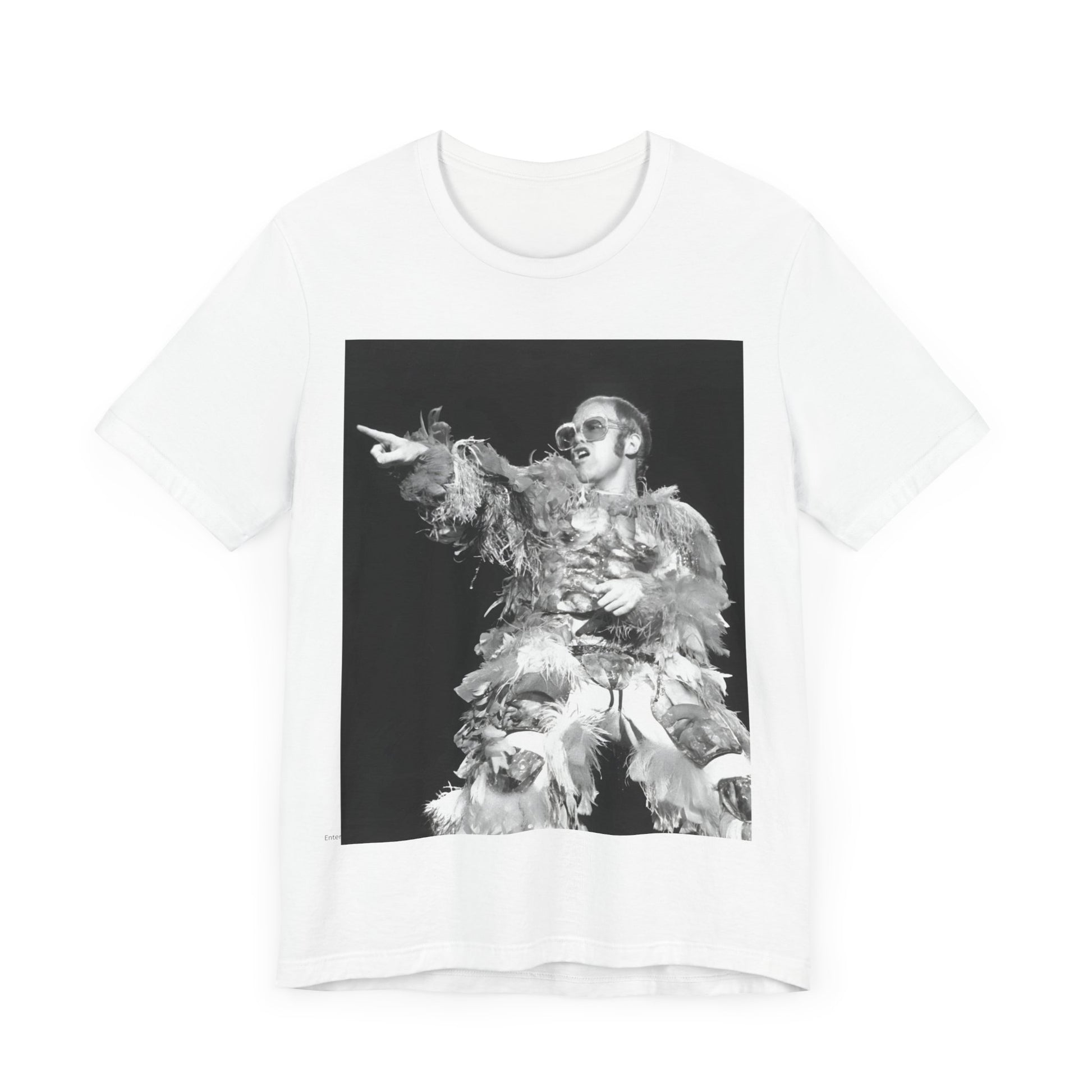 A black graphic t-shirt featuring a retro graphic of Elton John as a rock legend performing live.