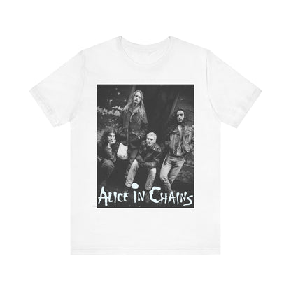 A black graphic t-shirt featuring a 90s black and white photographic portrait of the band Alice In Chains, capturing their iconic grunge look.