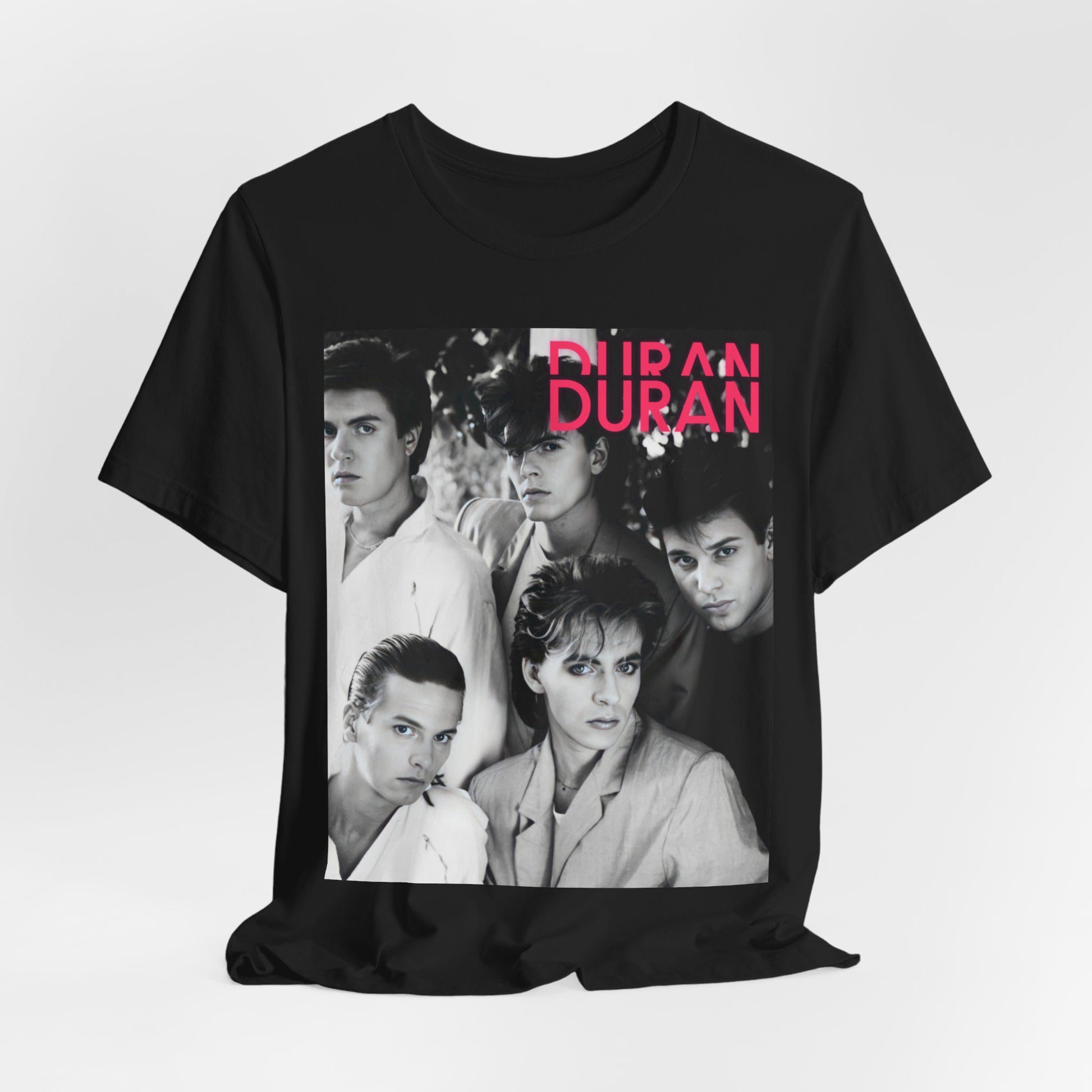 A black graphic t-shirt featuring a black and white graphic or photo of Duran Duran, designed with an 80s retro aesthetic.
