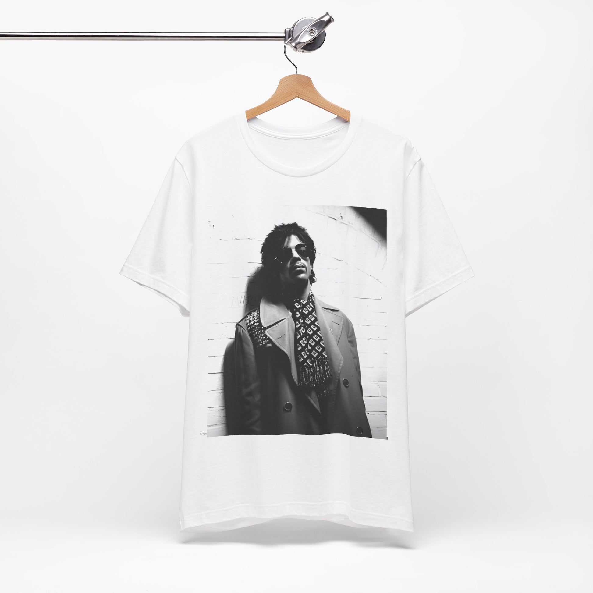A black graphic t-shirt featuring Prince's iconic symbol, representing 'The Artist Formerly Known As'.