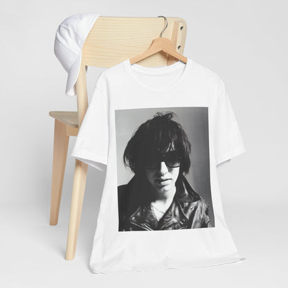 A black graphic t-shirt featuring a graphic related to The Strokes' 'Reptilia' song or era.