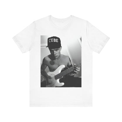 A black graphic t-shirt featuring a black and white graphic or photo of Flea from Red Hot Chili Peppers performing live on stage.