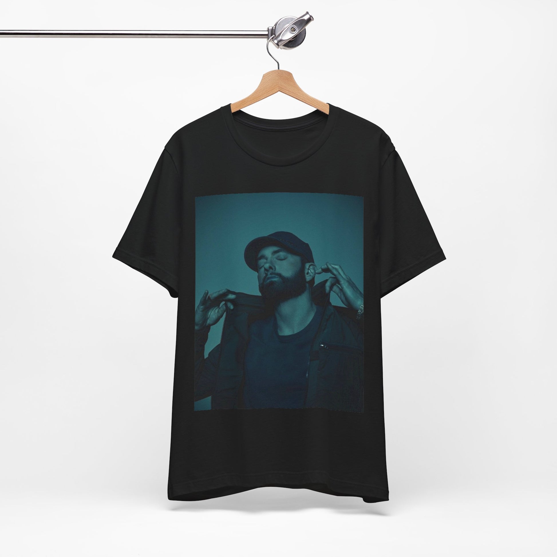 A black graphic t-shirt featuring a graphic of Eminem as a 'Rap God'.