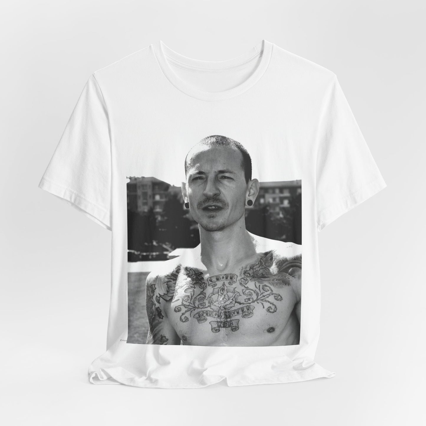 A black graphic t-shirt featuring a black and white graphic or photo portrait of Chester Bennington from Linkin Park.