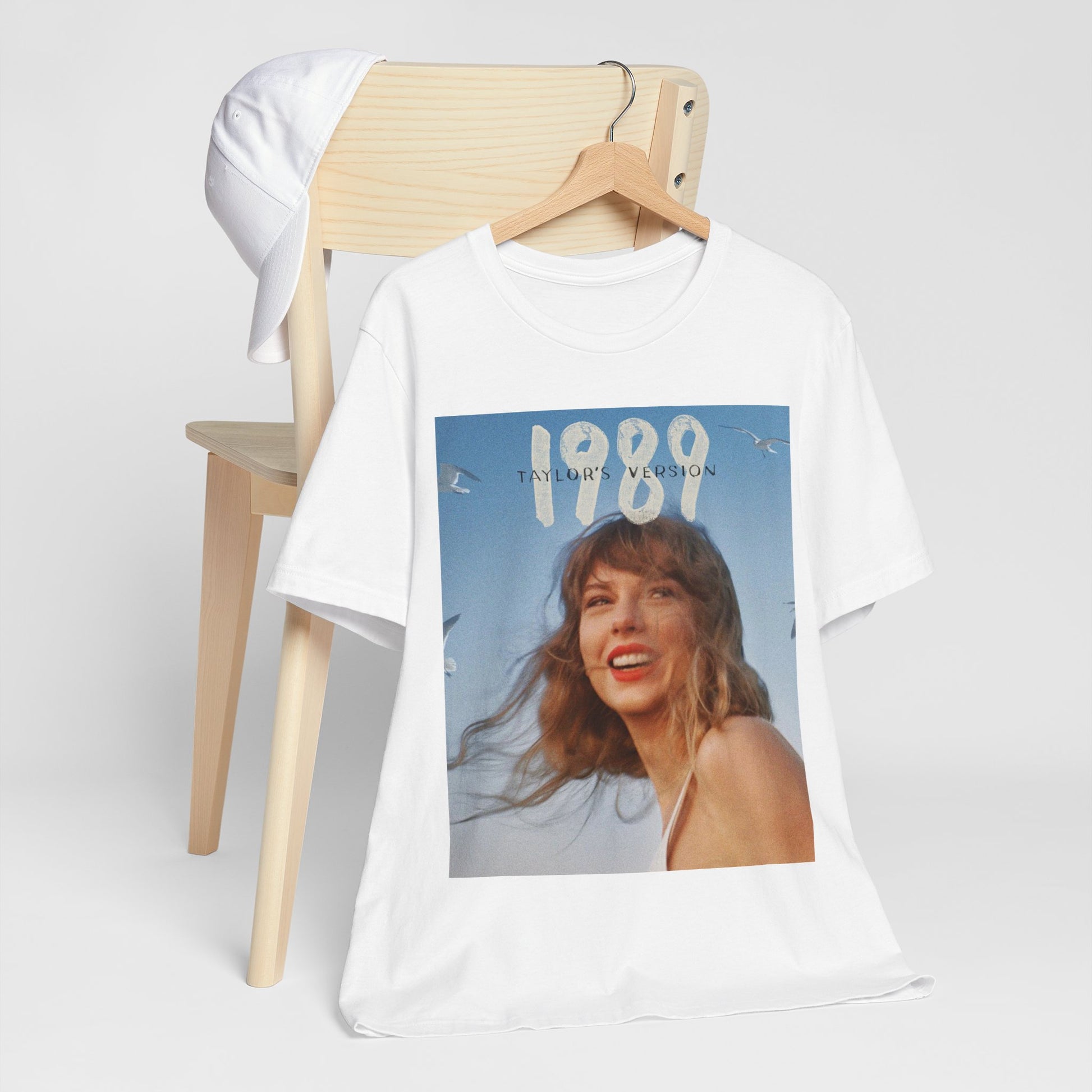A black graphic t-shirt featuring a graphic related to Taylor Swift's 1989 album.