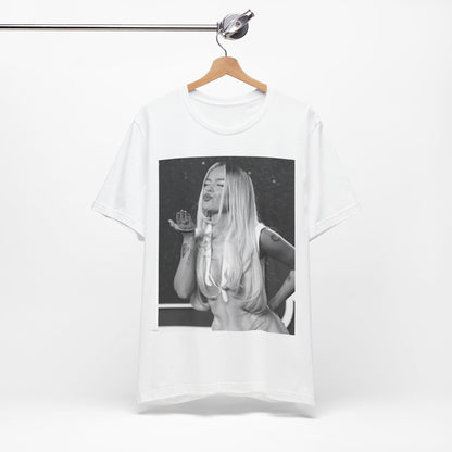 A black graphic t-shirt featuring a graphic of Karol G with a 'La Bichota Kiss' theme.