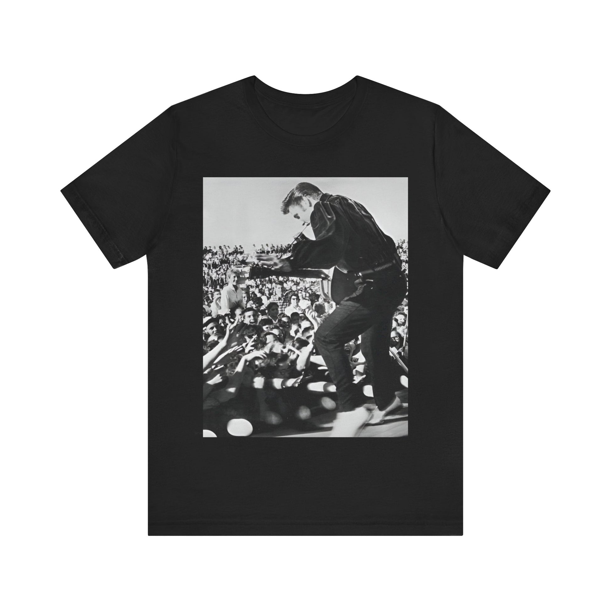 A black graphic t-shirt featuring a retro photo of Elvis Presley performing live in concert in the 1950s.