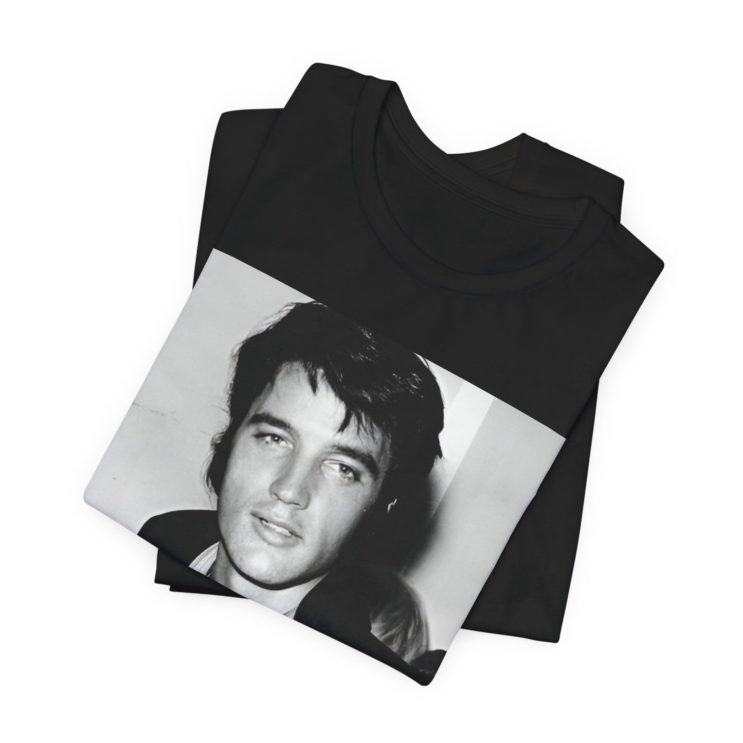 A black graphic t-shirt featuring a black and white rock and roll portrait photo of Elvis Presley.