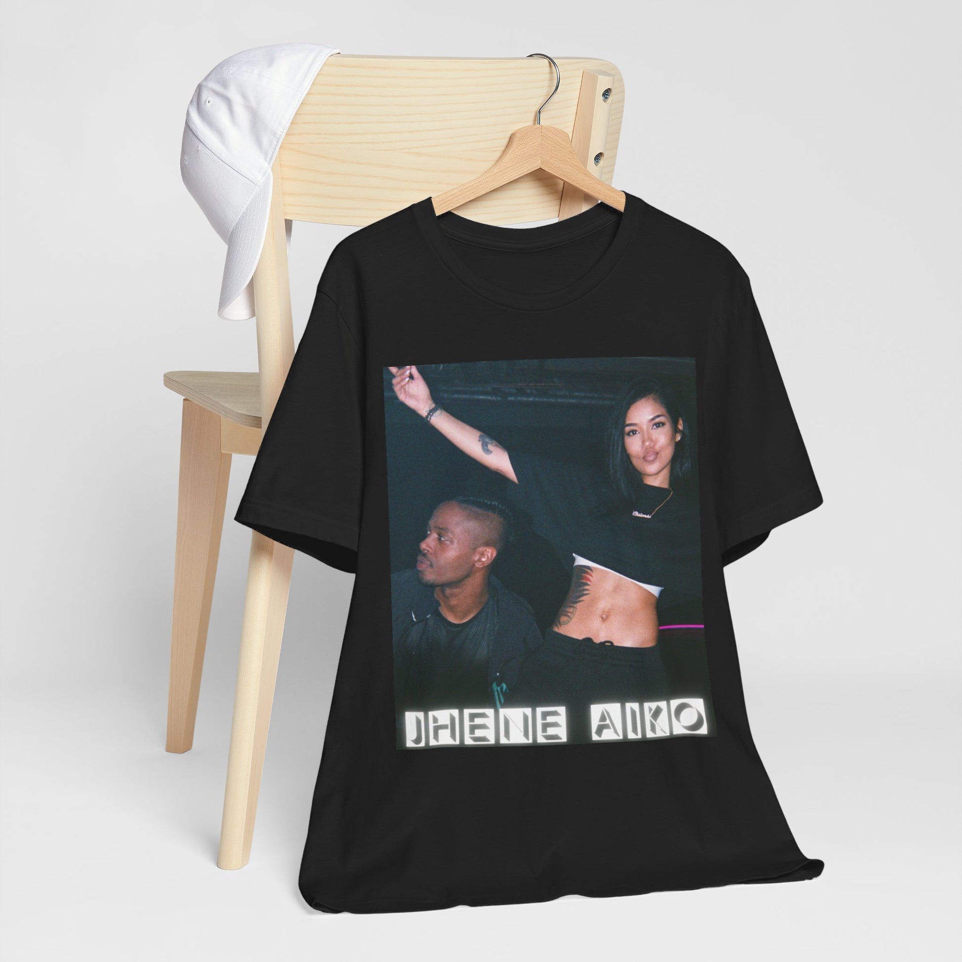 A black graphic t-shirt featuring a retro R&B essential graphic of Jhene Aiko.