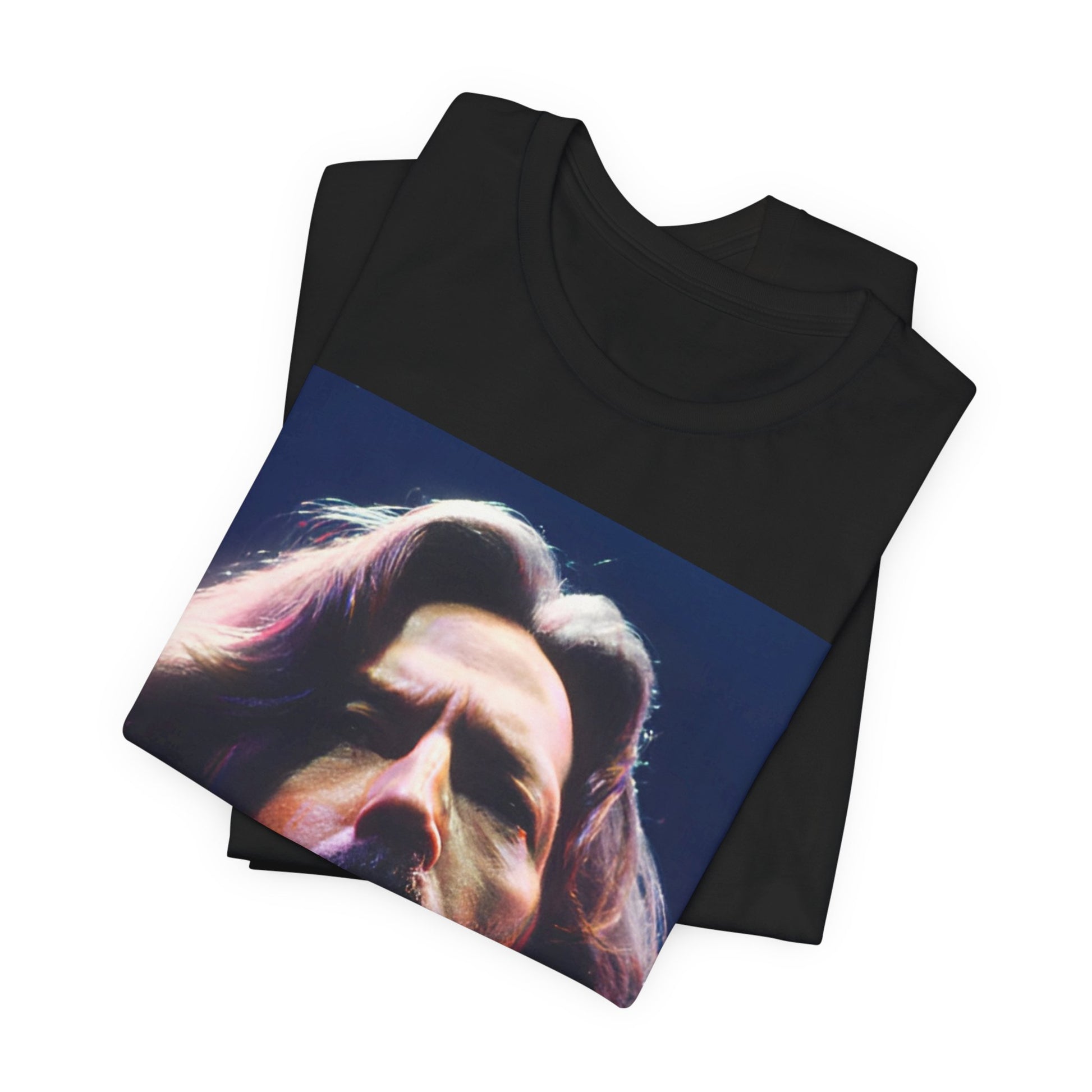 A black graphic t-shirt featuring a graphic related to Eric Clapton's 'Tears in Heaven' song or era.