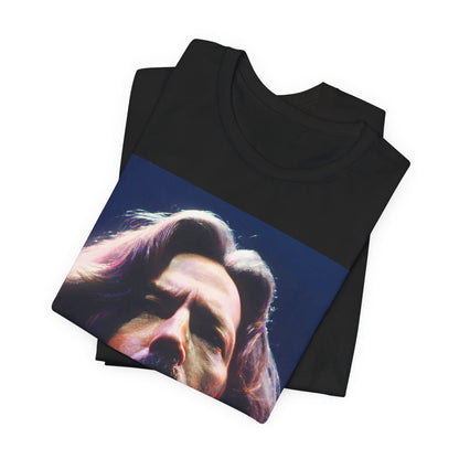 A black graphic t-shirt featuring a graphic related to Eric Clapton's 'Tears in Heaven' song or era.