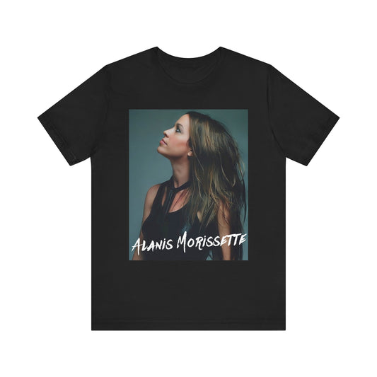 A black graphic t-shirt featuring a retro-style graphic of Alanis Morissette, possibly with her signature or a unique artistic interpretation.