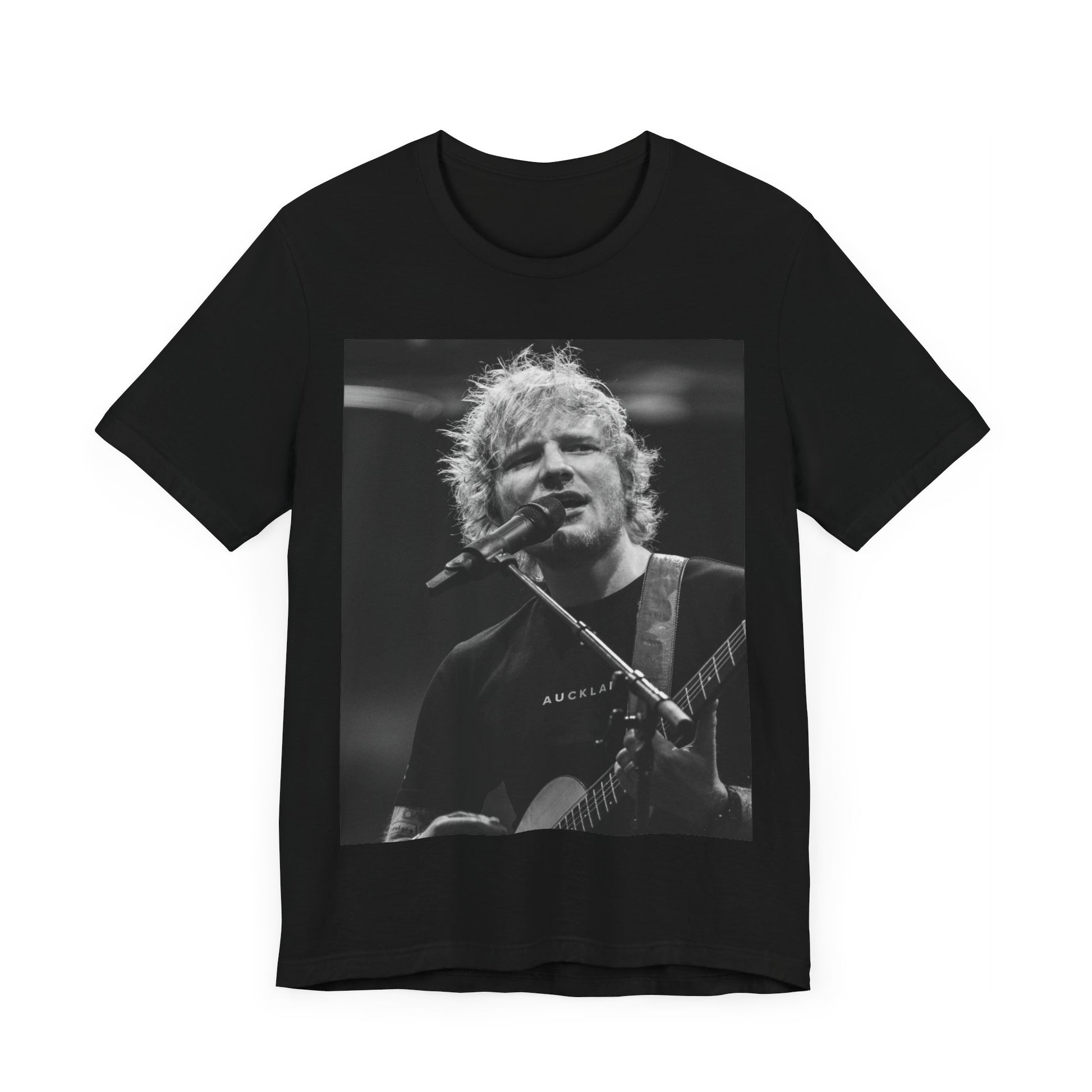 A black graphic t-shirt featuring a black and white photo of Ed Sheeran performing live.