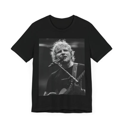 A black graphic t-shirt featuring a black and white photo of Ed Sheeran performing live.