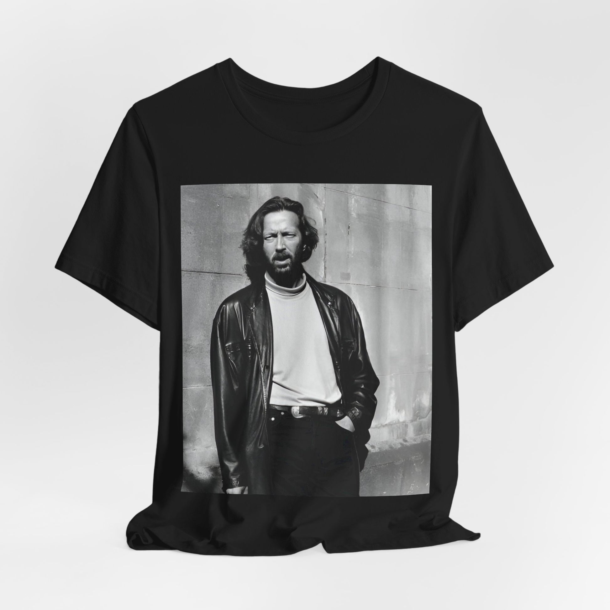 A black graphic t-shirt featuring a retro graphic related to Eric Clapton's 'Cocaine' song or era.