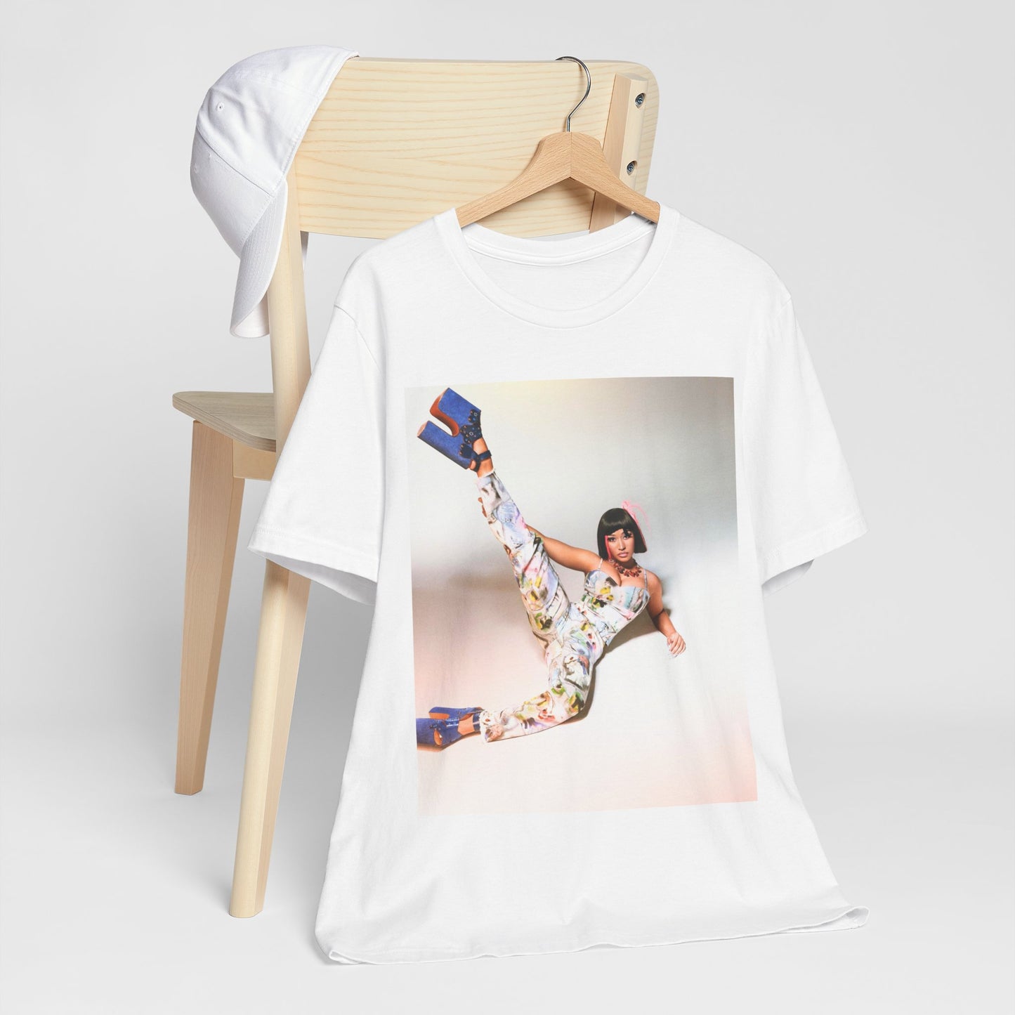 A black graphic t-shirt featuring a graphic of Nicki Minaj as a global fashion rap queen.