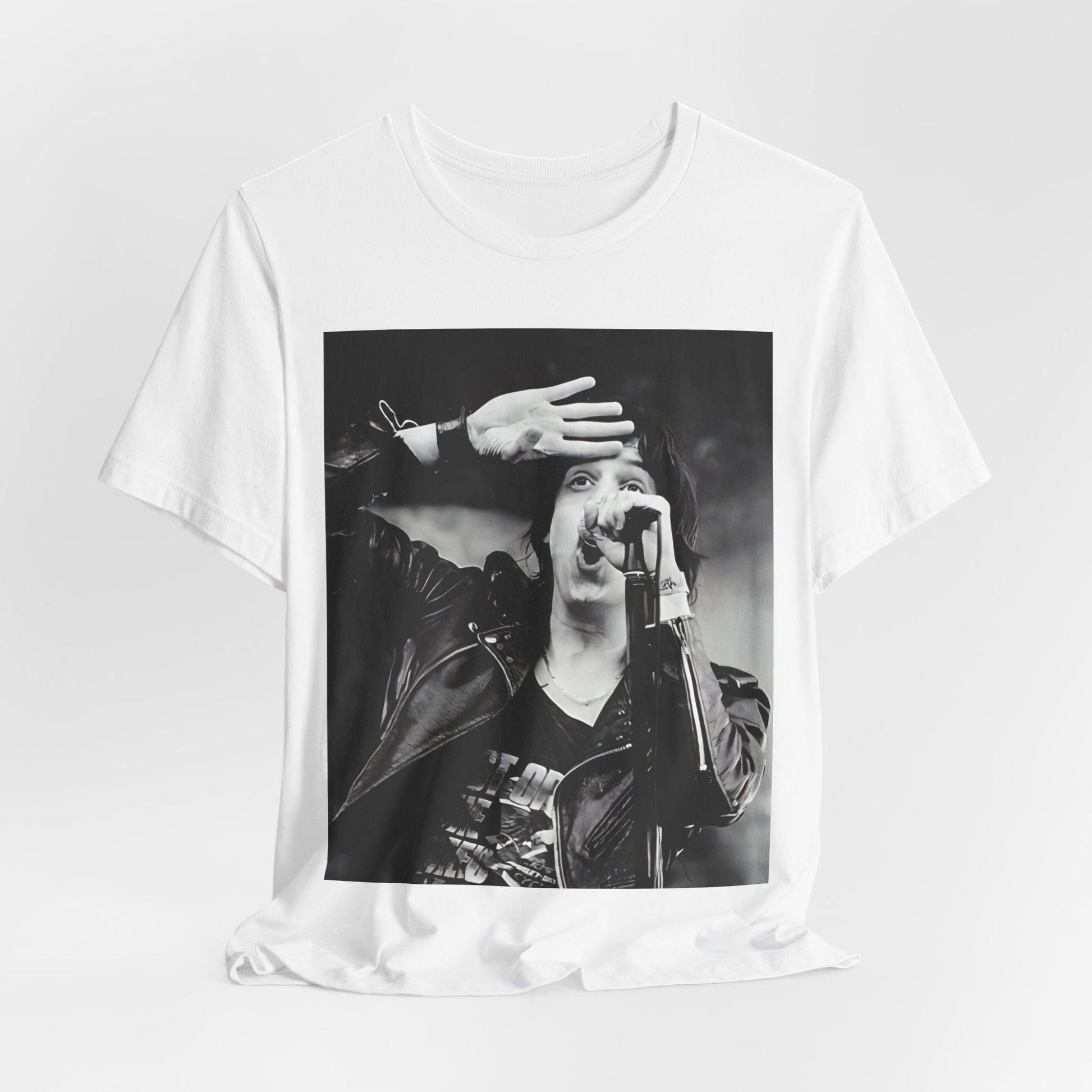 A black graphic t-shirt featuring a black and white portrait photo of The Strokes band.