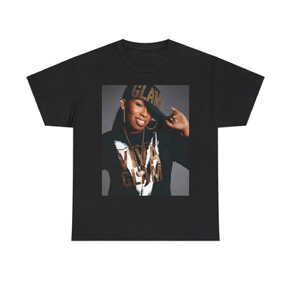 A black graphic t-shirt featuring a 90s graphic of Missy Elliott as a global rap phenomenon.