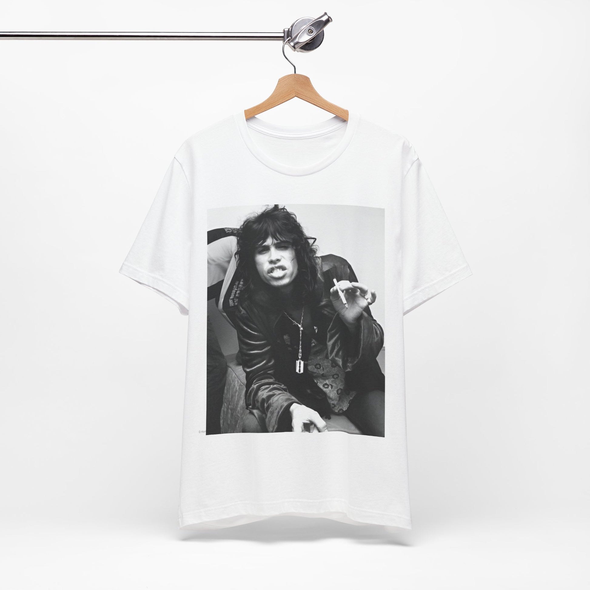 A black graphic t-shirt featuring a retro 70s photo of Aerosmith band members lounging in leather, exuding a cool, classic rock vibe.