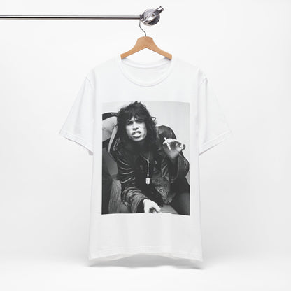A black graphic t-shirt featuring a retro 70s photo of Aerosmith band members lounging in leather, exuding a cool, classic rock vibe.