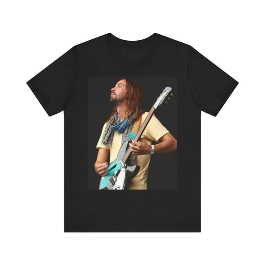 A black graphic t-shirt featuring a vintage indie rock graphic of Tame Impala.
