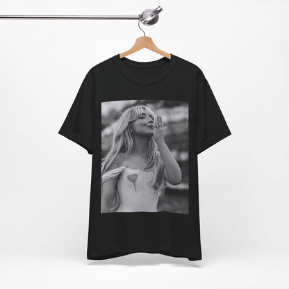 A black graphic t-shirt featuring a graphic or photo of Sabrina Carpenter kissing on stage during a performance.