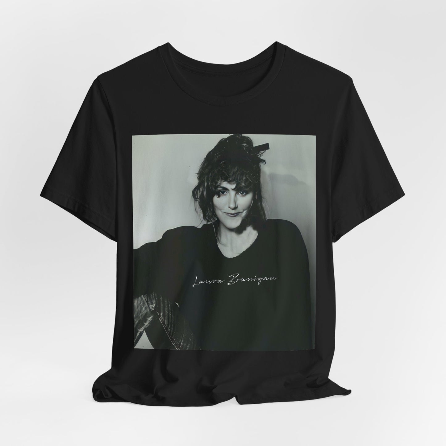 A black graphic t-shirt featuring a casual 80s pop fan graphic of Laura Branigan.